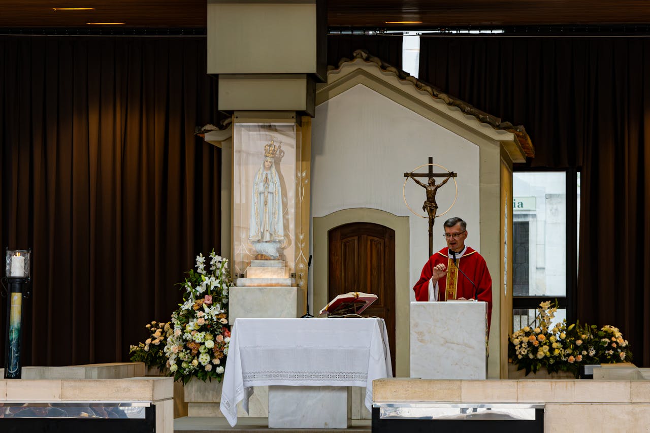 A priest conducting mass at the Fátima Sanctuary altar in Portugal.